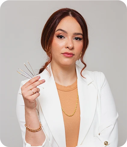 brazilian woman redhead beautician beauty professional eyebrow designer holding tweezers